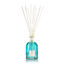 A fragrance diffuser with clear glass bottle and blue liquid, topped with several white diffusing sticks.