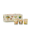 Set of three small candles with colorful designs in front of a decorative box on a white background