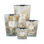 Set of four hand blown glass candles on a white background