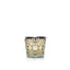 Decorative candle with intricate design on a white background