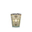 Decorative candle with intricate design on a white background