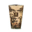 Decorative candle in a container with tree design and 'Baboon' branding on a white background